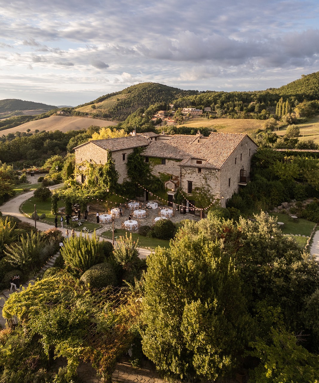 Castello di Petrata at golden hour, overlooking the Umbrian hills